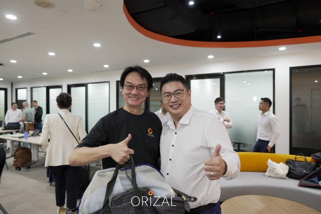 Two Orizal advisors smiling in the office