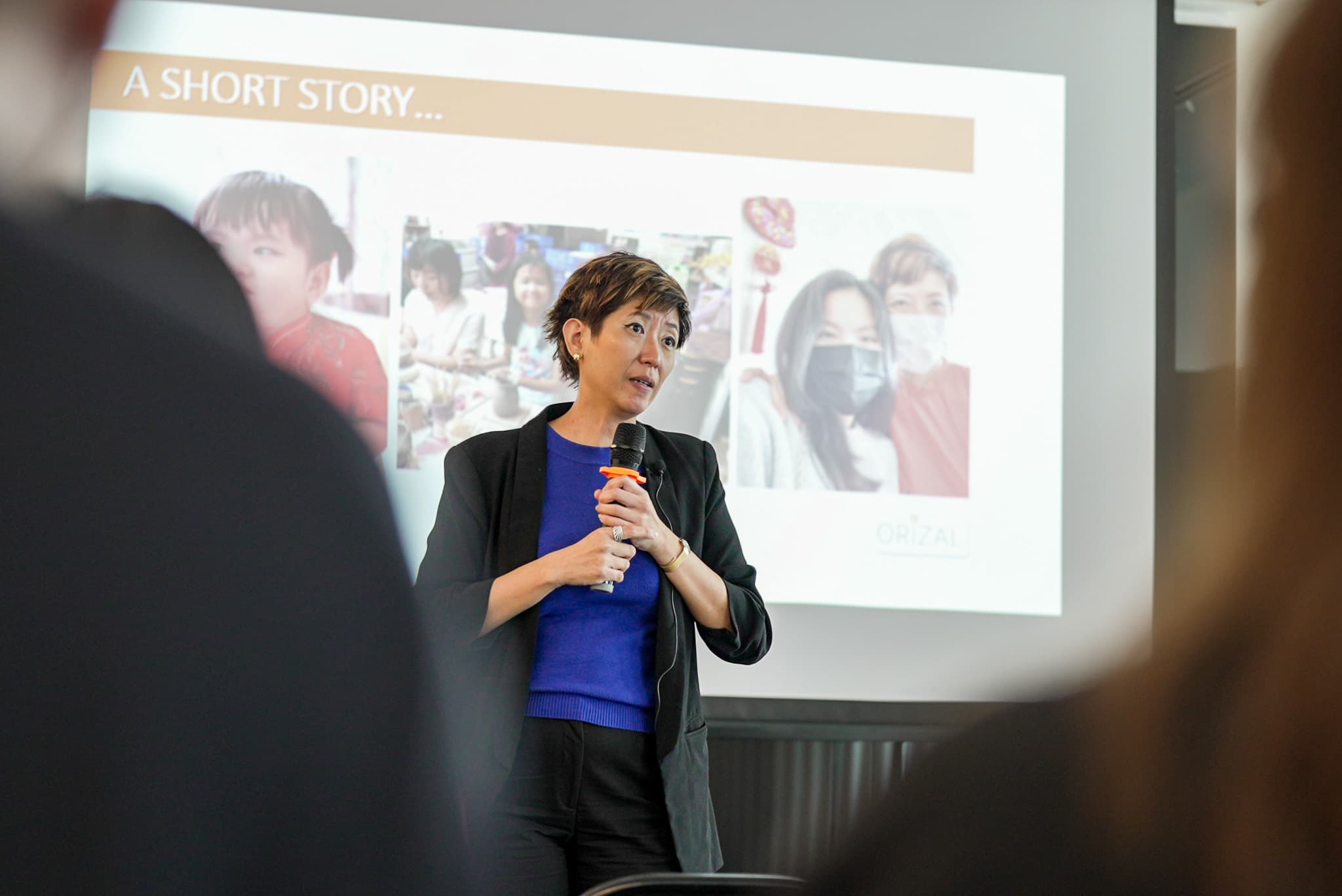 An Orizal advisor speaking during a client education session