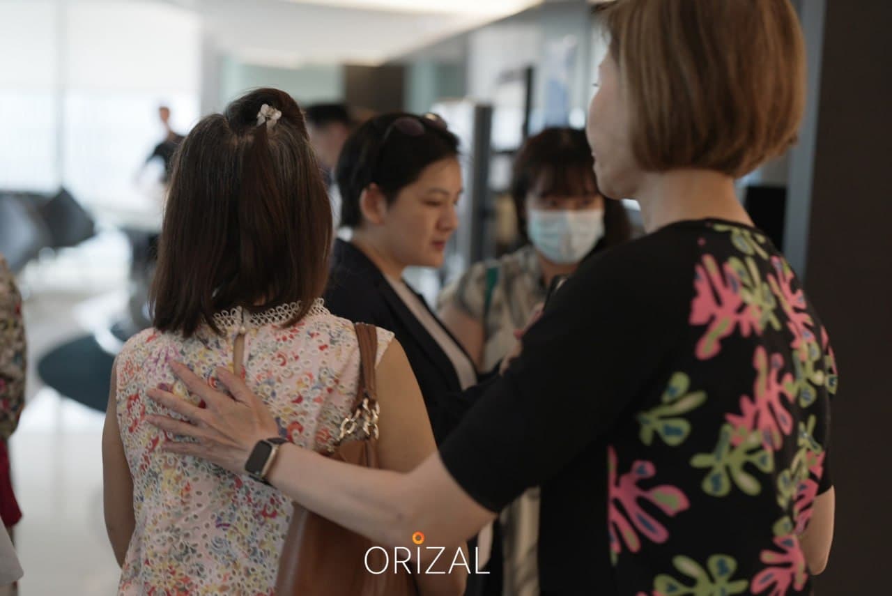 An Orizal advisor greeting a guest during a day-in-the-life shoot