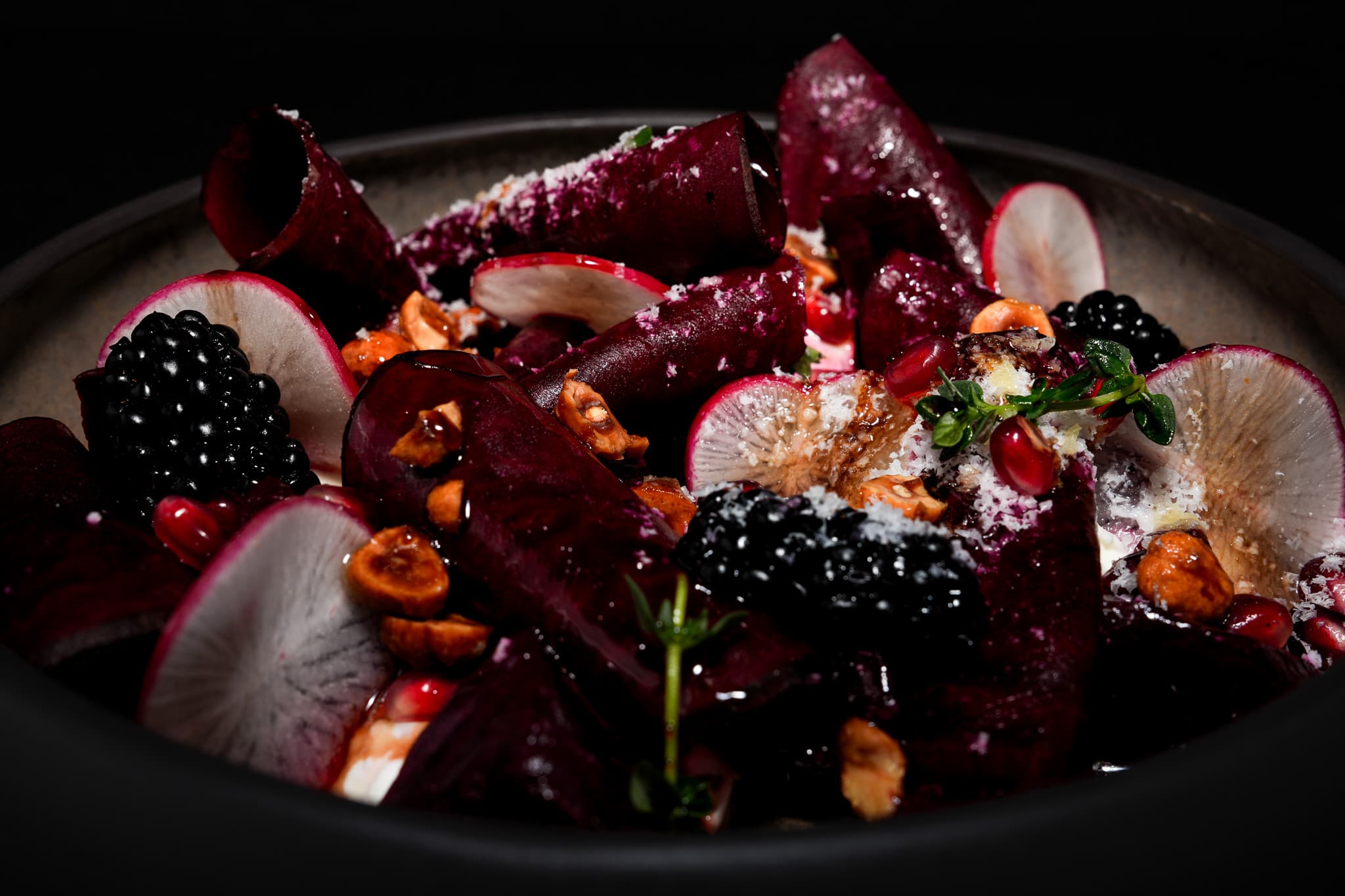 Dark beetroot salad with fruit and garnish from Pera