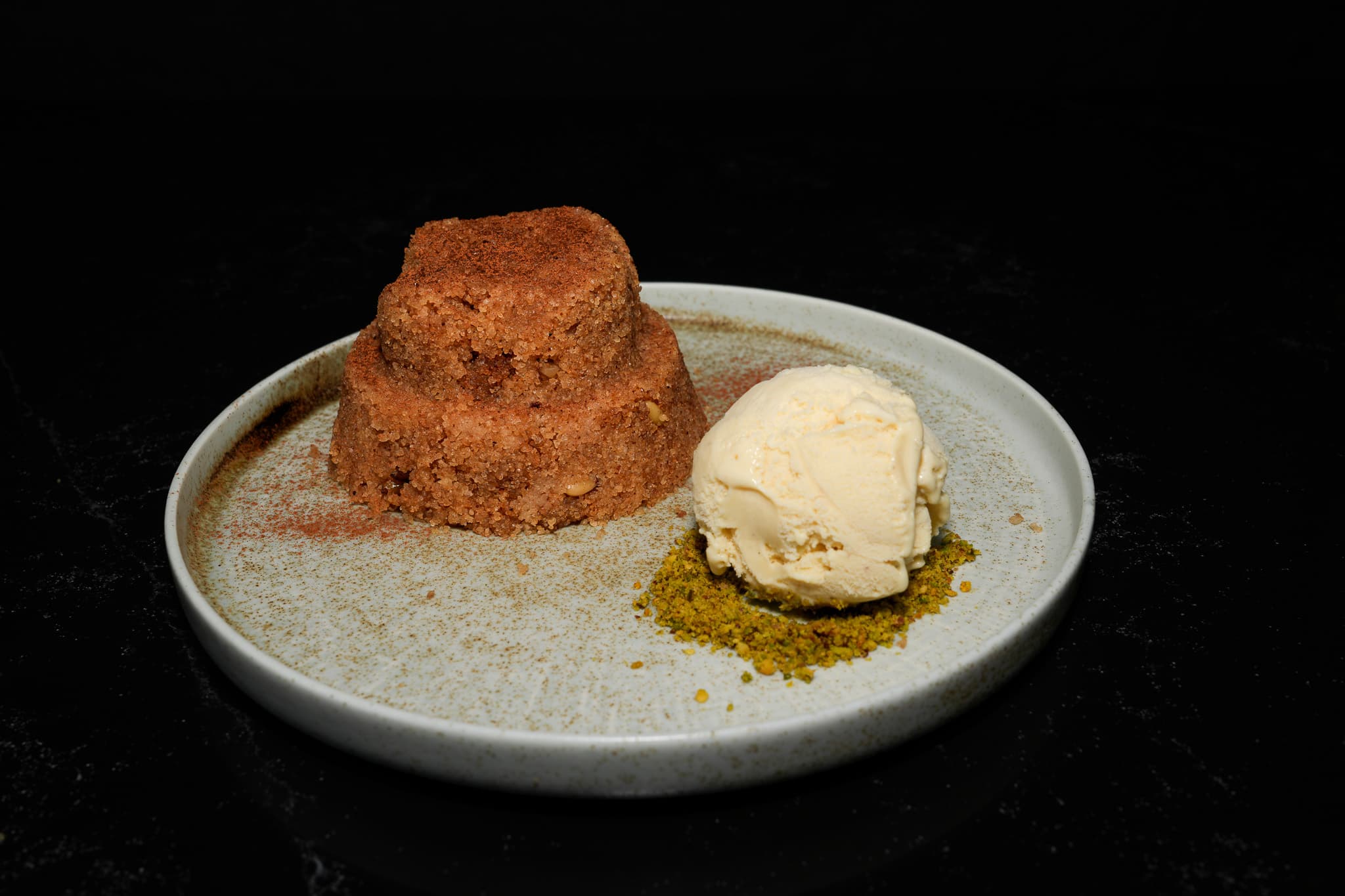 Turkish dessert with ice cream on a ceramic bowl at Pera