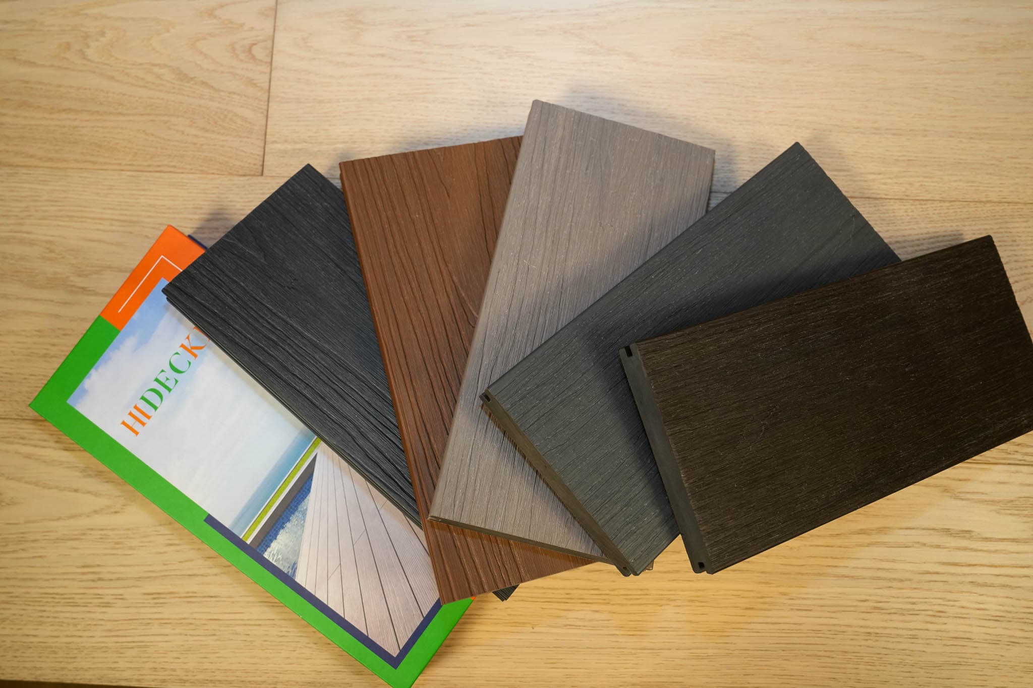 Hidecki decking sample boards spread beside the brochure