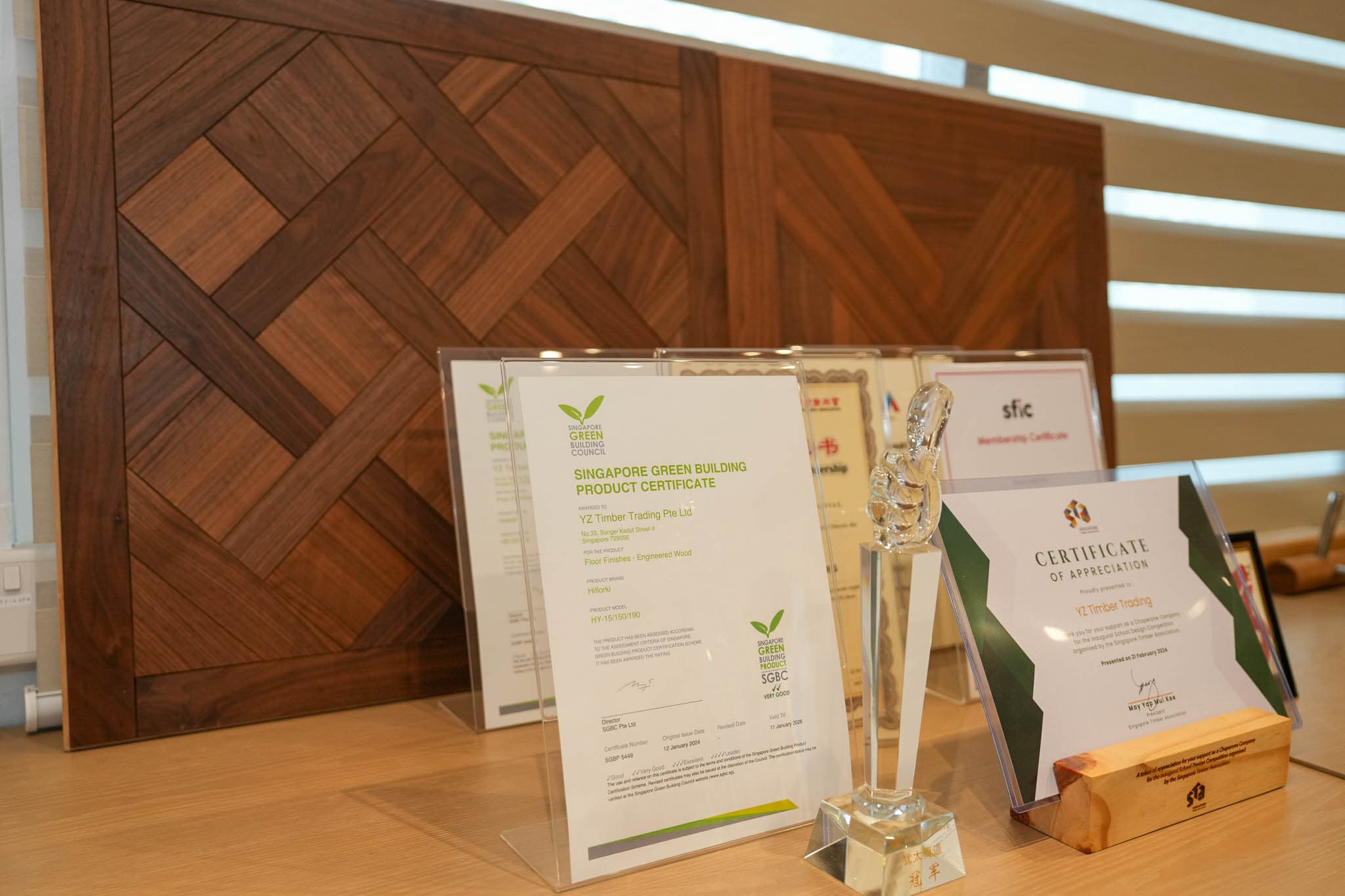 YZ Timber showroom certificates, awards, and product samples