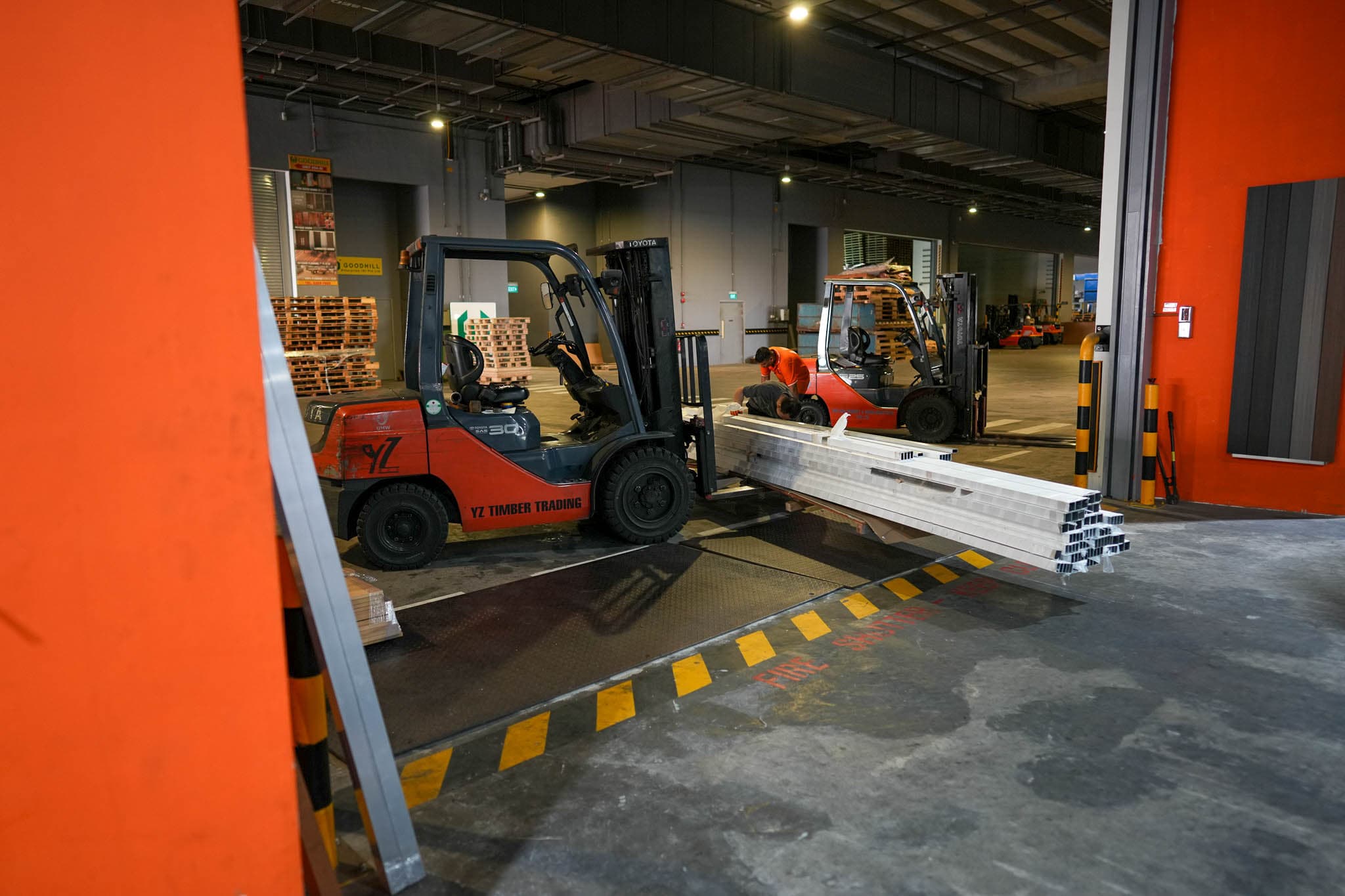 Forklift moving timber at the YZ Timber loading bay