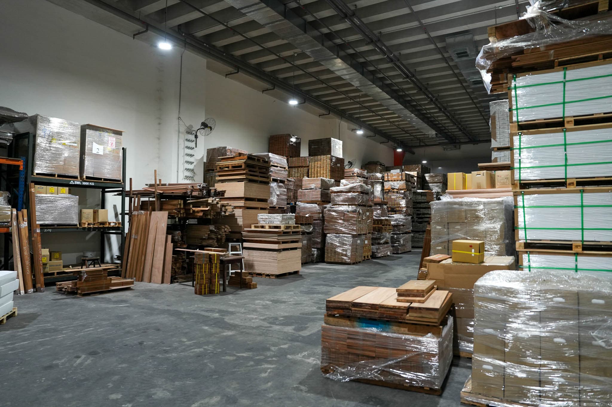 Rows of wrapped timber inventory inside the YZ Timber warehouse