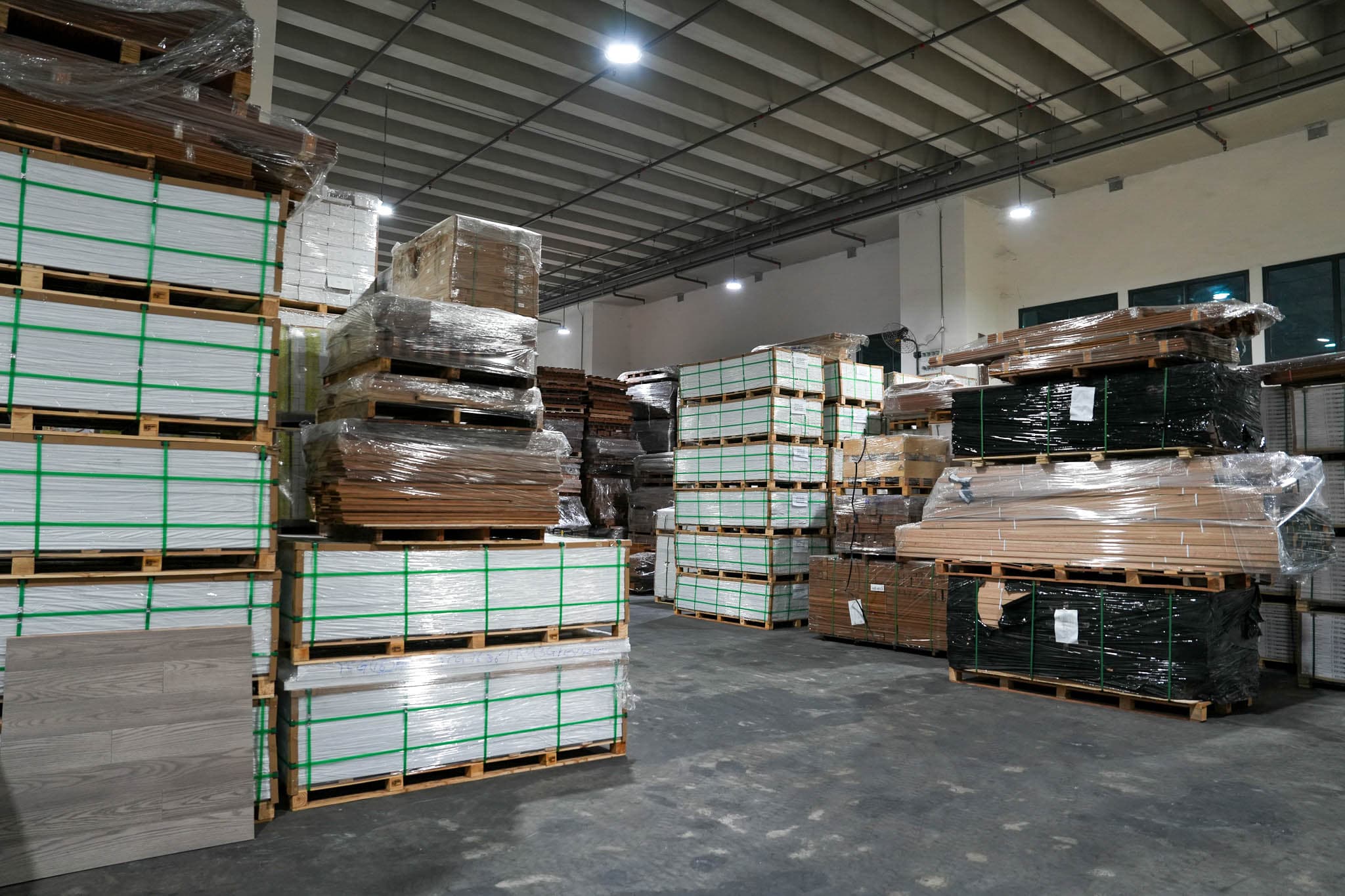 Stacked pallets of timber materials in the YZ Timber warehouse