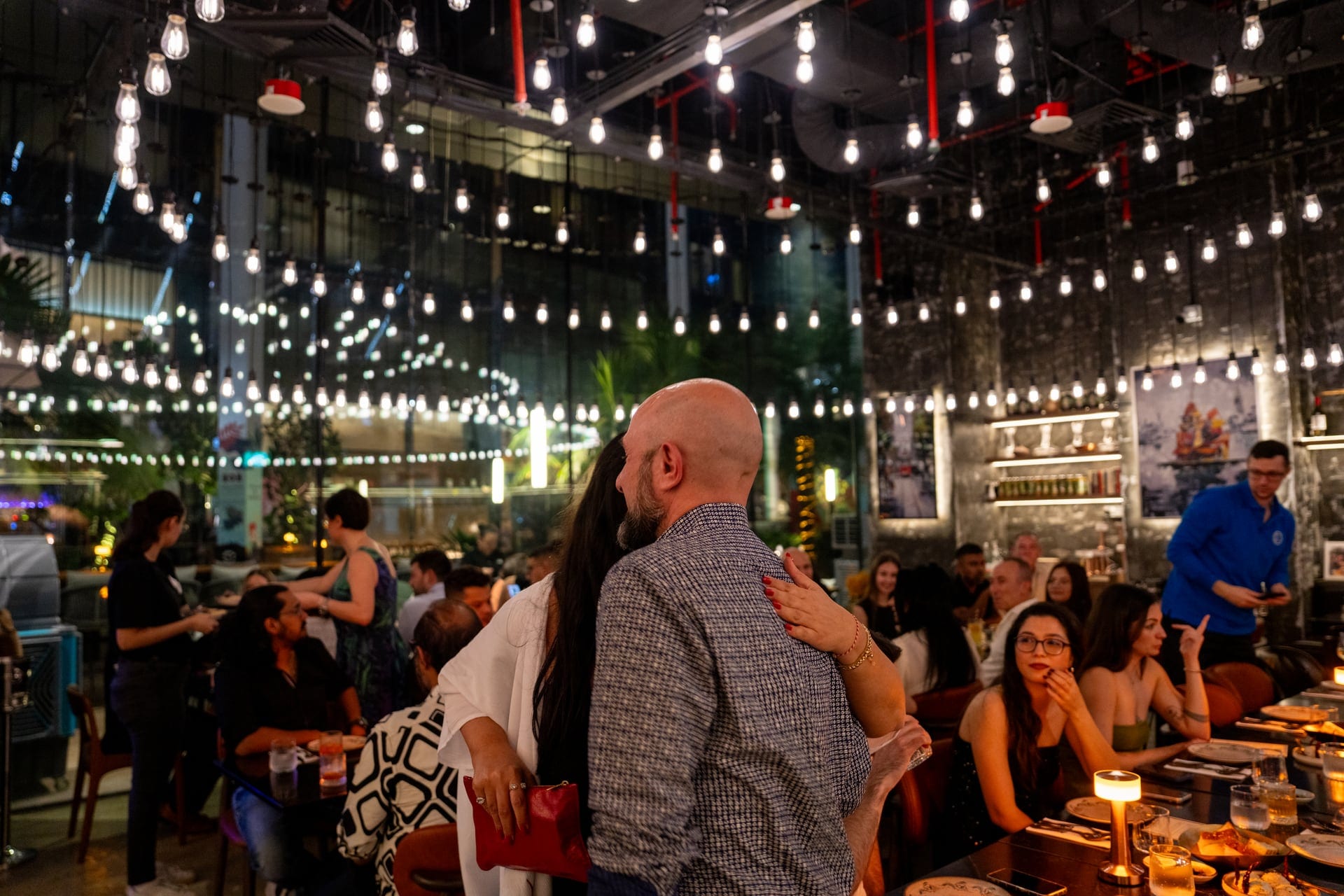 Evening corporate gathering at Pera with guests dining and talking