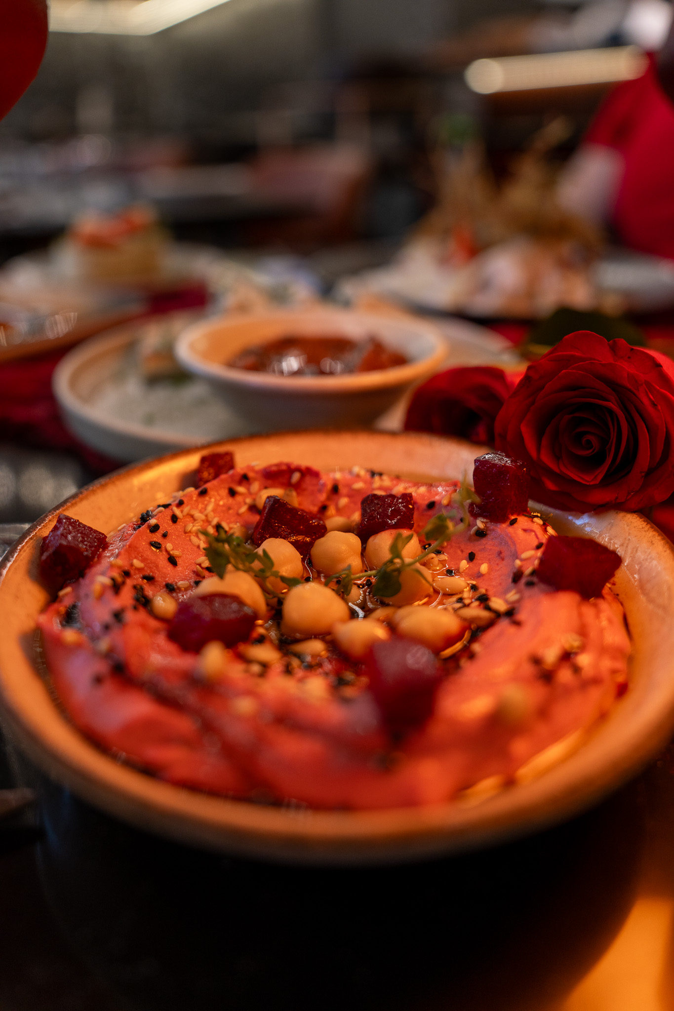 Beetroot hummus with rose garnish
